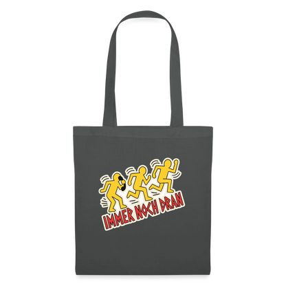 Immer noch dran. Pop-Art-Motiv Stoffbeutel, Farbe Graphite