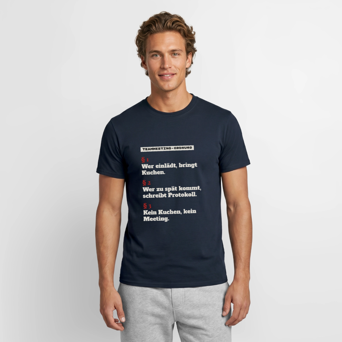 "Teammeeting-Ordnung: wer einlädt, bringt Kuchen." Motiv-T-Shirt für Männer, Farbe Navy