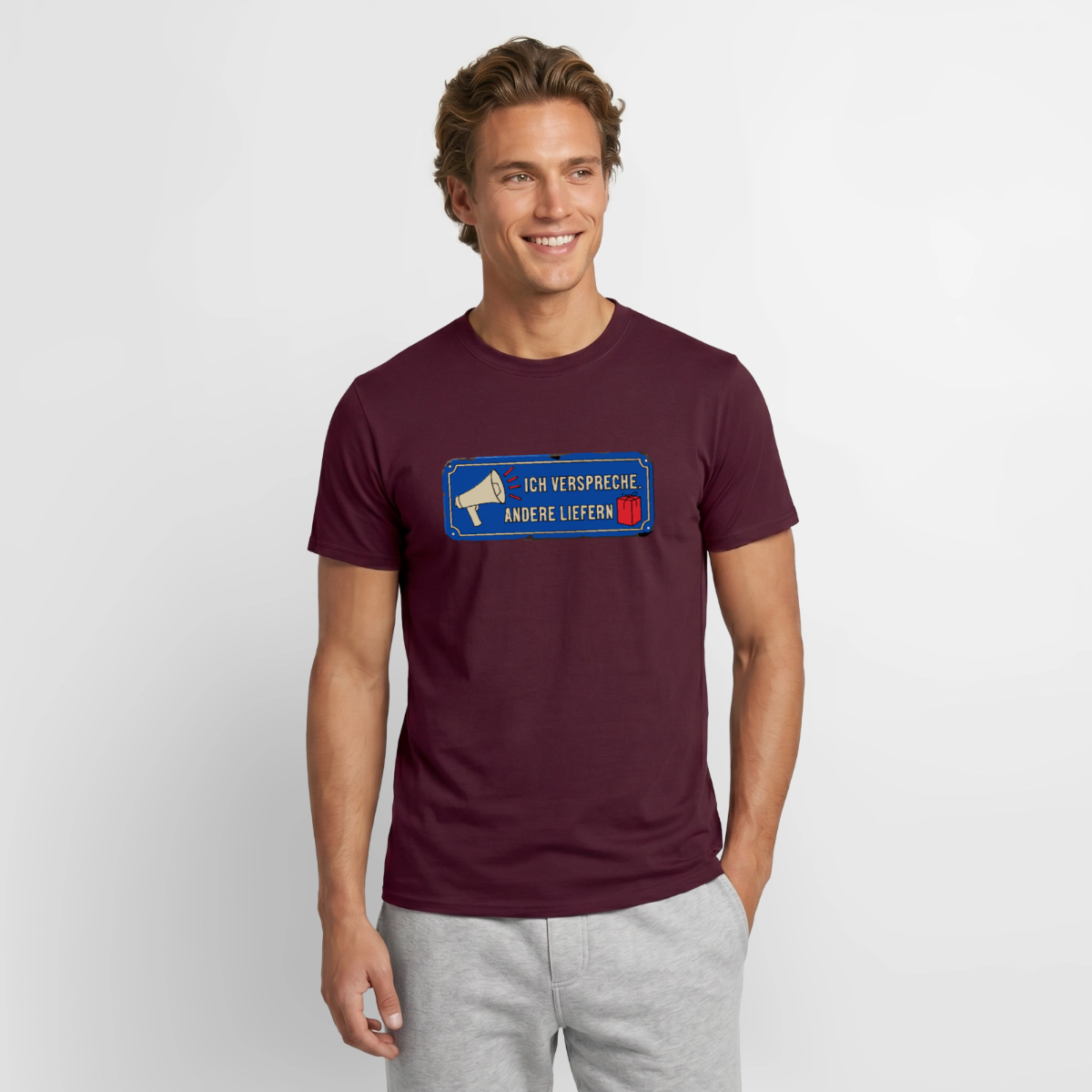 Ich verspreche. Andere liefern. Motiv-T-Shirt für Männer, Farbe Ziegelrot, Model
