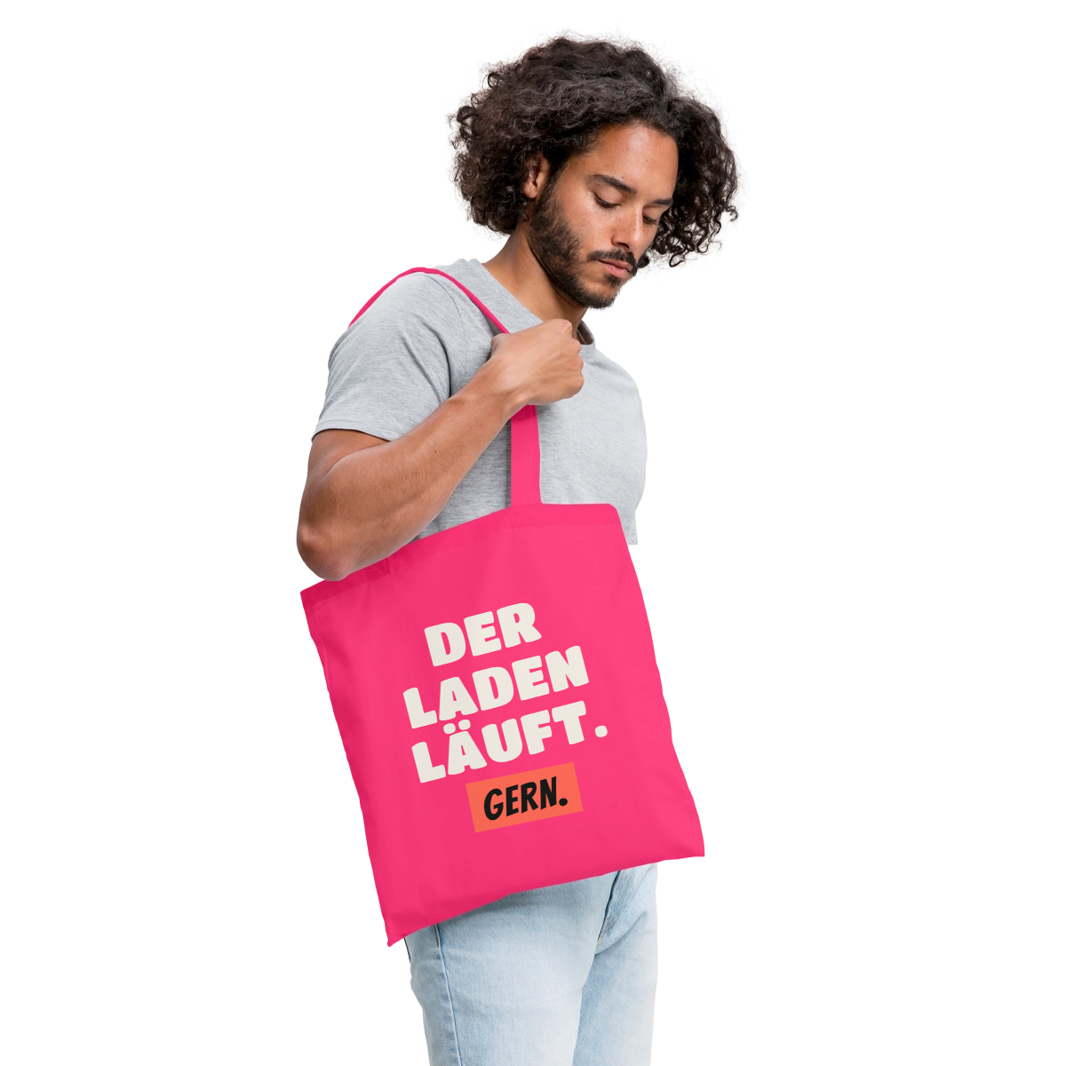 "Der Laden läuft. Gern." Stoffbeutel, Farbe Azalea, Model