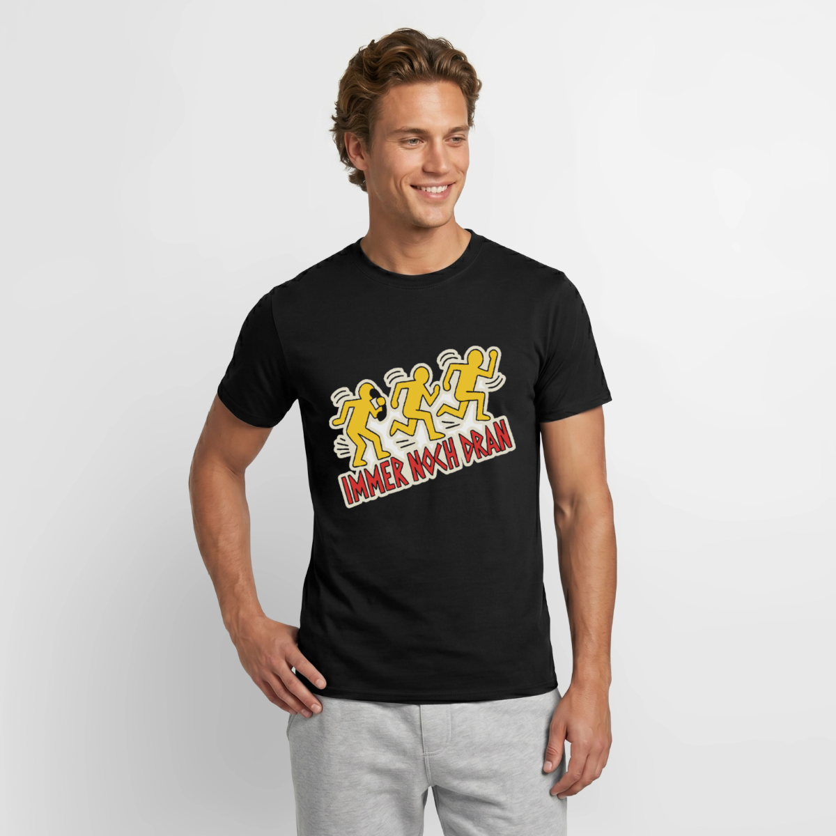 "Immer noch dran. Pop-Art-Motiv" Motiv-T-Shirt für Männer, Farbe Schwarz, Model