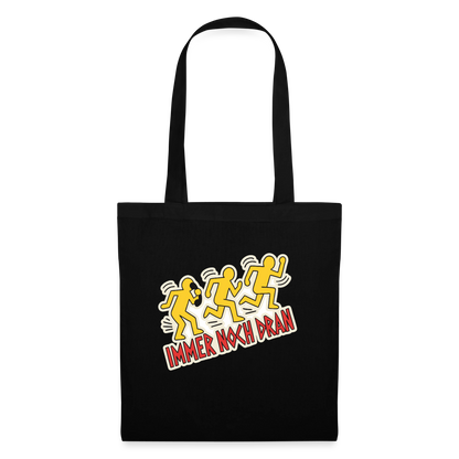 Immer noch dran. Pop-Art-Motiv Stoffbeutel, Farbe Schwarz