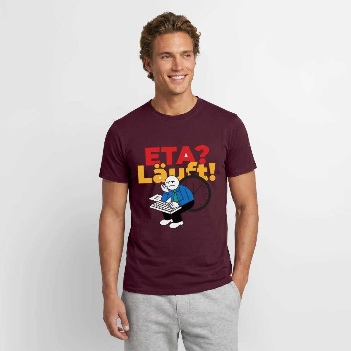 "ETA? Läuft! Strichfiguren-Motiv" Motiv-T-Shirt für Männer, Farbe Ziegelrot