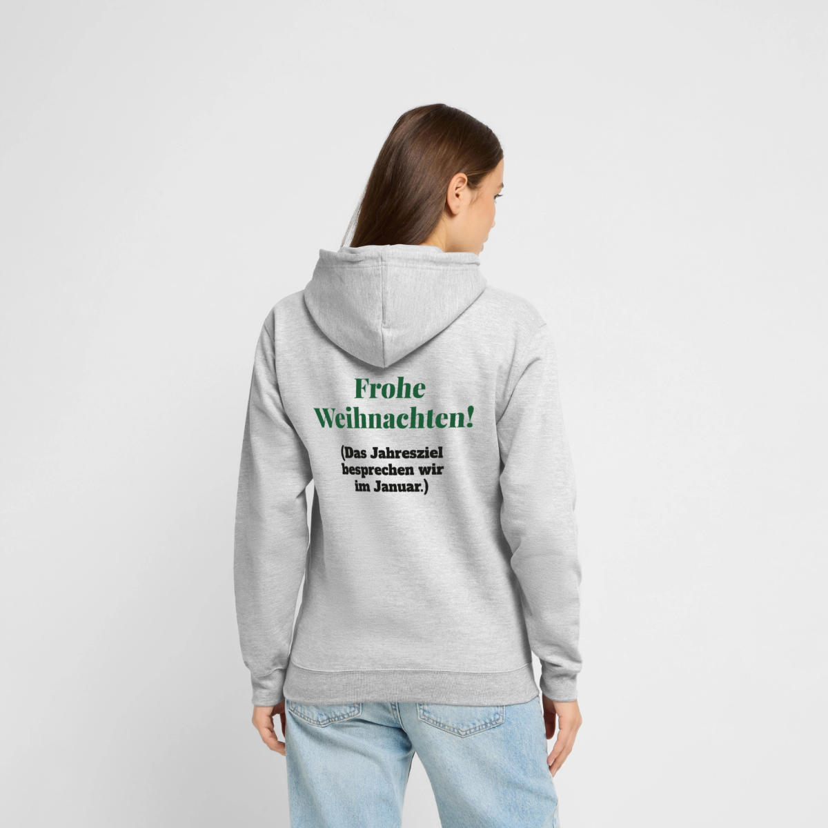 "Frohe Weihnachten! Das Jahresziel besprechen wir im Januar." Motiv-Hoodie unisex, Farbe Hellgrau meliert, Model