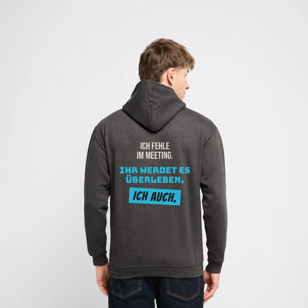 "Ich fehle im Meeting. Ihr werdet es überleben. Ich auch." Motiv-Hoodie unisex, Farbe Anthrazit, Model