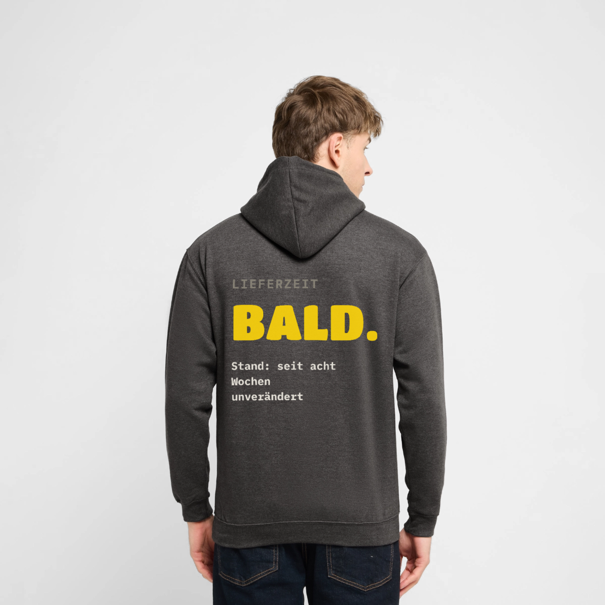 "Lieferzeit: bald. Stand: seit acht Wochen unverändert." Motiv-Hoodie unisex, Farbe Anthrazit
