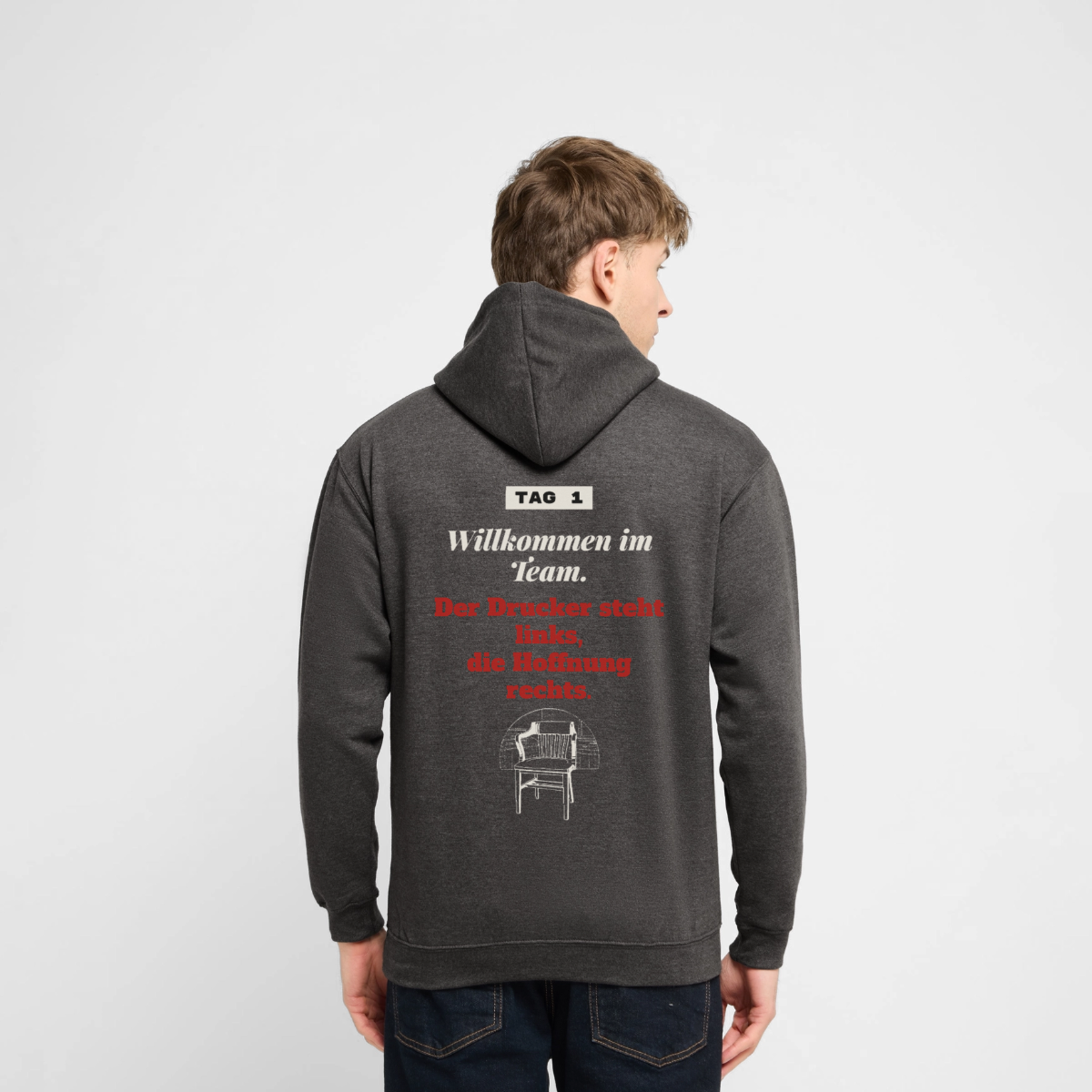 "Willkommen im Team. Der Drucker steht links, die Hoffnung rechts." Motiv-Hoodie unisex, Farbe Anthrazit, Model
